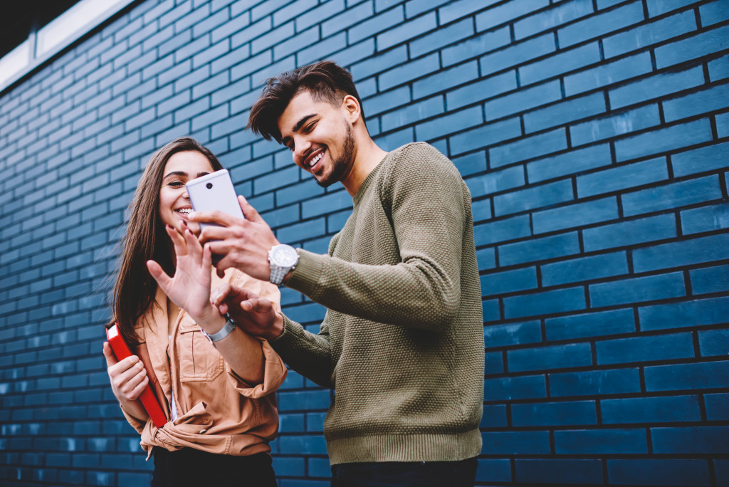 couple looking at a smartphone screen