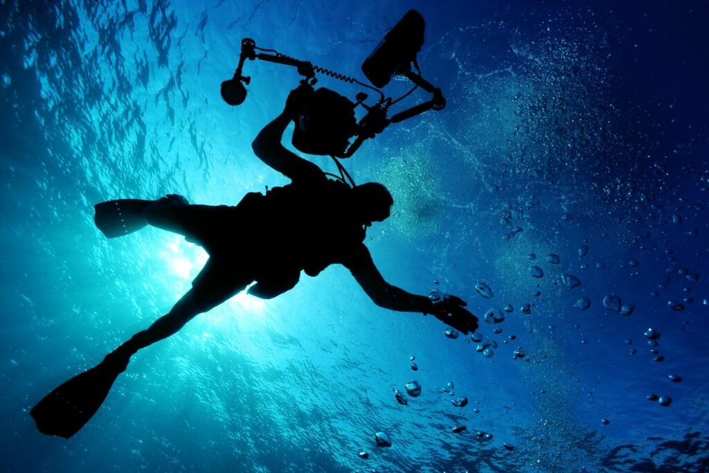scuba driver shot by an underwater camera